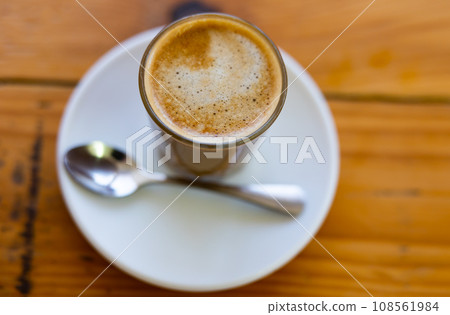 Freshly prepared cortado coffee in glass 108561984