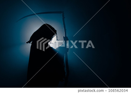 silhouette of death with a scythe. Dark reaper on a black background. Skeleton, skull, silhouette of silhouette of death with a scythe. Dark reaper on a black background. Skeleton, skull, silhouette of 108562034