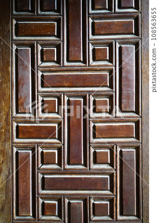 Old rotten wormy ancient oak door, decorative wooden textured castle door Old rotten wormy ancient oak door, decorative wooden textured castle door 108563655