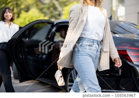 Business lady getting out the car 108563967