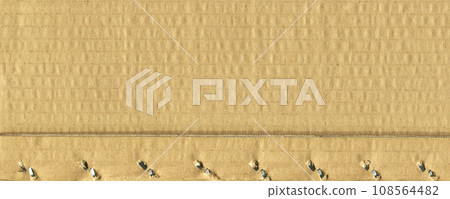 Brown and beige colored corrugated cardboard detail Brown and beige colored corrugated cardboard detail 108564482