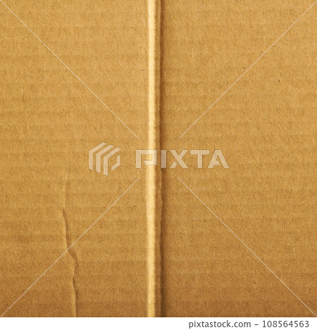 Brown and beige colored corrugated cardboard detail 108564563