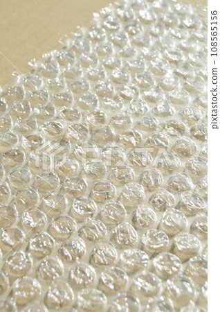 On corrugated cardboard paper plastic air bubble protection foil wrap texture background On corrugated cardboard paper plastic air bubble protection foil wrap texture background 108565156