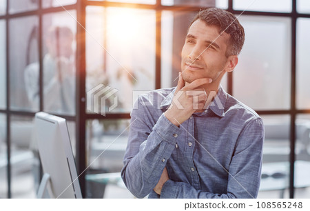 Serious thoughtful millennial business man looking away 108565248