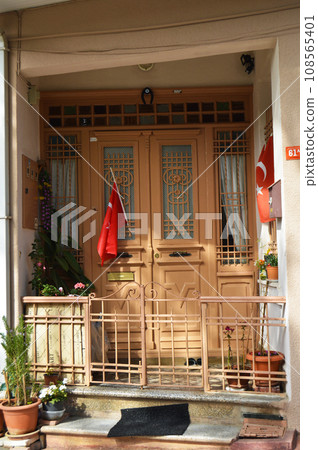 Old brown and beige wooden entrance door of house in Turkey Istanbul Buyukada 108565401