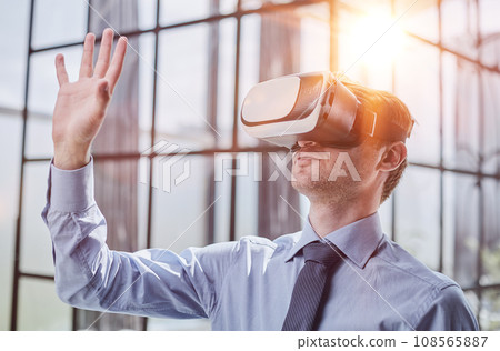 businessman in virtual reality headset in the office 108565887