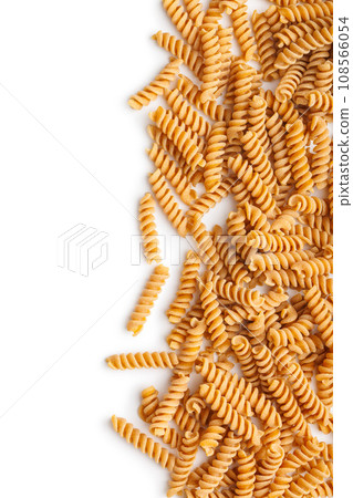 Raw whole grain fusilli pasta. Uncooked pasta isolated on white background. 108566054