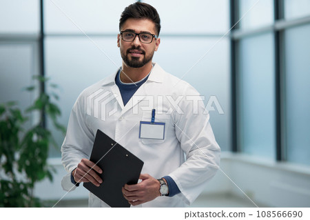 experienced doctor with a folder in his hands l experienced doctor with a folder in his hands l 108566690