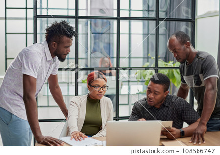 Business people collaborating in office and working on project together Business people collaborating in office and working on project together 108566747