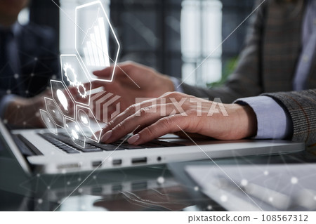 man's hands typing on laptop keyboard in interior man's hands typing on laptop keyboard in interior 108567312