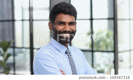 Successful businessman looking at camera with confidence Successful businessman looking at camera with confidence 108567316