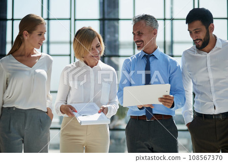 Office routine. Female assistant manager discussing statistics with male chief executive officer. 108567370