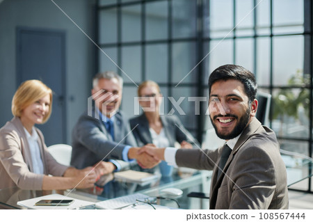 Multicultural professionals project managers group negotiating in boardroom at meeting. 108567444