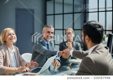 Multicultural professionals project managers group negotiating in boardroom at meeting. Multicultural professionals project managers group negotiating in boardroom at meeting. 108567446