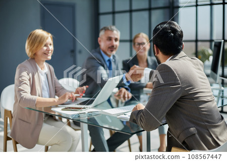 Multicultural professionals project managers group negotiating in boardroom at meeting. 108567447