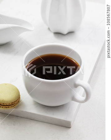 Cup of coffee with macaroons on the table Cup of coffee with macaroons on the table 108567807