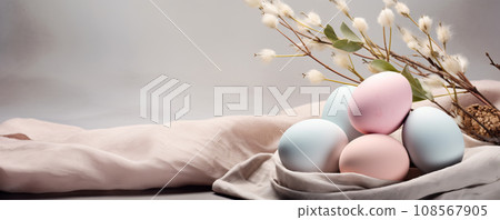 Composition with beautiful pastel colored Easter eggs, spring plant leaves and cloth on grey background 108567905