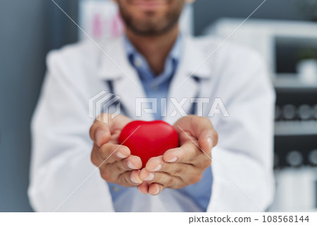 Doctor man holding red heart, Cardiology concept. Doctor man holding red heart, Cardiology concept. 108568144