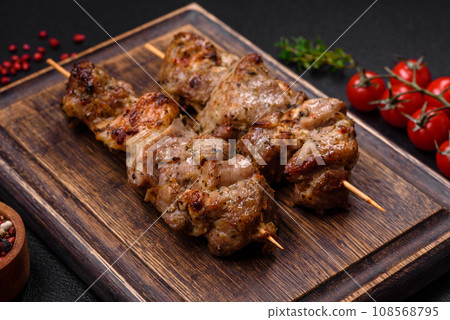 Delicious fried shish kebab of chicken or pork meat with salt, spices and herbs 108568795