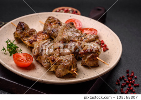 Delicious fried shish kebab of chicken or pork meat with salt, spices and herbs 108568807