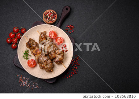 Delicious fried shish kebab of chicken or pork meat with salt, spices and herbs 108568810