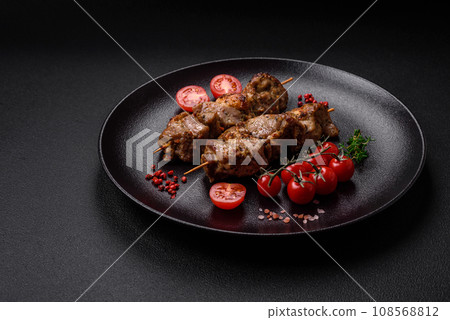 Delicious fried shish kebab of chicken or pork meat with salt, spices and herbs 108568812