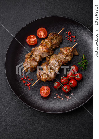 Delicious fried shish kebab of chicken or pork meat with salt, spices and herbs 108568814