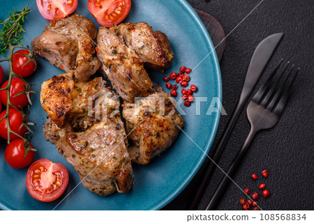 Delicious fried shish kebab of chicken or pork meat with salt, spices and herbs Delicious fried shish kebab of chicken or pork meat with salt, spices and herbs 108568834