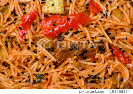 Delicious udon noodles with meat or seafood, vegetables, salt and spices 108568854