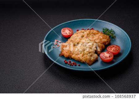 Delicious baked chicken or turkey chops with salt, spices and herbs 108568937
