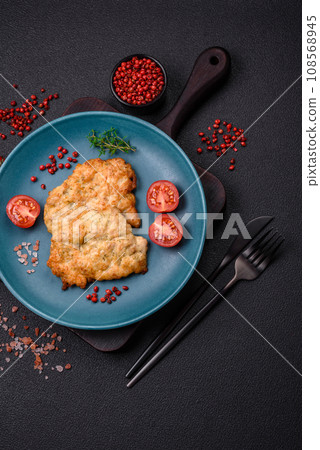 Delicious baked chicken or turkey chops with salt, spices and herbs 108568945
