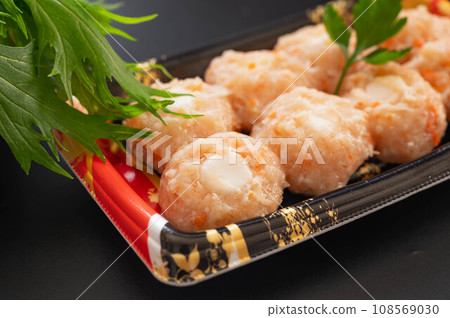 Hot pot ingredients: Chicken meatball dumplings and mizuna Hot pot ingredients: Chicken meatball dumplings and mizuna 108569030