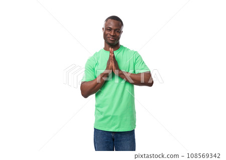 young american man in casual t-shirt thinking over white background young american man in casual t-shirt thinking over white background 108569342
