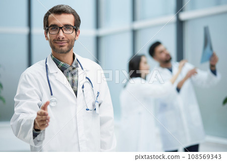 image of the doctor holding out his hand for greeting 108569343