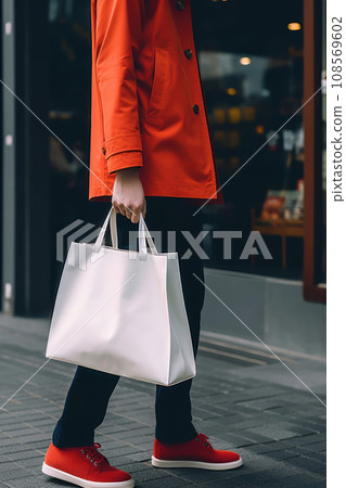 Cropped image of fashionable person walking with big white bag. Generative AI Cropped image of fashionable person walking with big white bag. Generative AI 108569602
