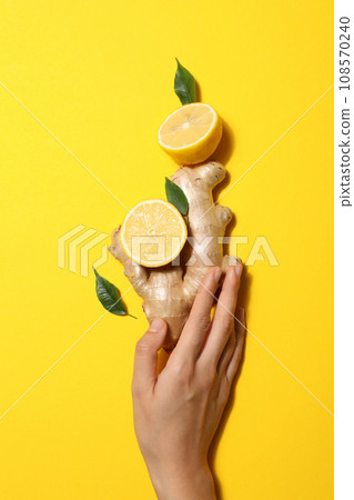 Fresh ginger root with fresh juicy lemon 108570240