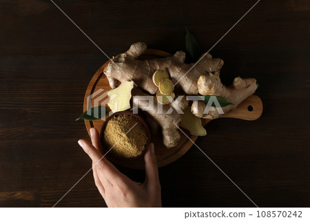 Fresh ginger root with ginger powder in a bowl 108570242