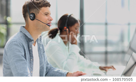 operators woman and man agent with headsets working in a call center operators woman and man agent with headsets working in a call center 108570505
