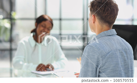 Group of business persons talking in the office. Group of business persons talking in the office. 108570555