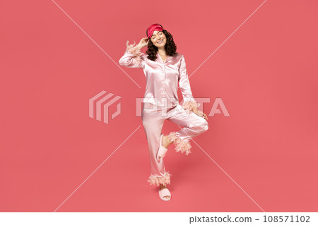 Beautiful girl in a sleeping mask and pajamas. Beautiful girl in a sleeping mask and pajamas. 108571102