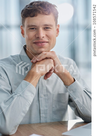 Shot of a young businessman using a laptop in a modern office 108571542