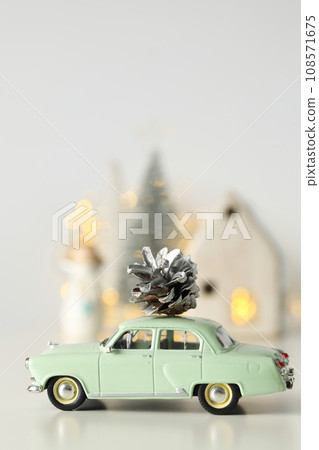 Car with a cone and New Year's decor. Car with a cone and New Year's decor. 108571675