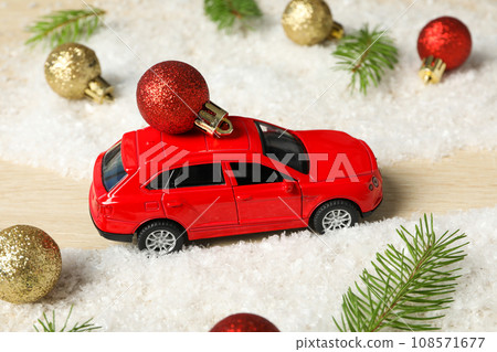 A car with a Christmas tree and New Year's decor. A car with a Christmas tree and New Year's decor. 108571677