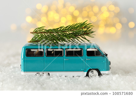 A car with a Christmas tree and New Year's decor. 108571680