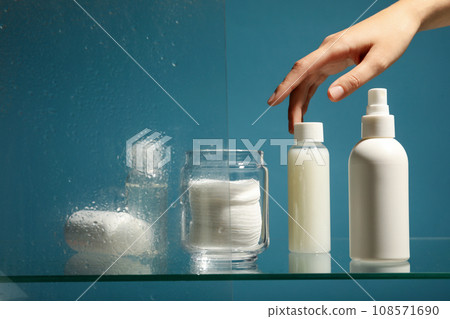 Hygiene products on the shelf in the bathroom Hygiene products on the shelf in the bathroom 108571690