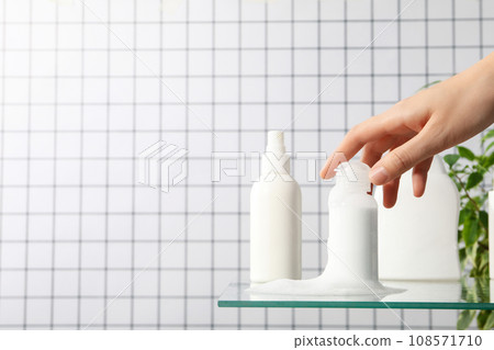 Hygiene products in the bathroom on a light background 108571710