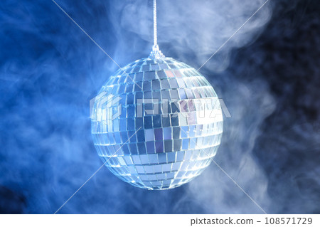 Disco ball in smoke on a dark background 108571729
