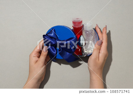 Lubricant and anal plug in a gift box. Lubricant and anal plug in a gift box. 108571741