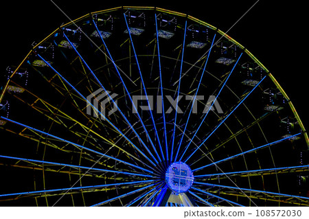 Amusement,pleasure. Illuminated ferris wheel,night Amusement,pleasure. Illuminated ferris wheel,night 108572030