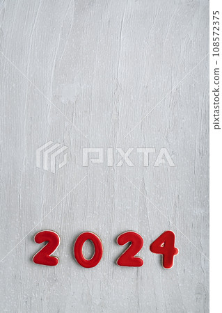 Red glazed painted cookies with numbers 2024 on light wooden background. Copy space, mockup Red glazed painted cookies with numbers 2024 on light wooden background. Copy space, mockup 108572375